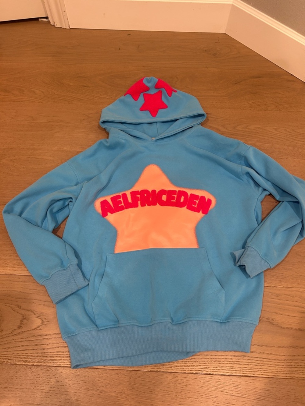 Aelfric Eden Blue Hoodie with Peach Star and Pink Accents